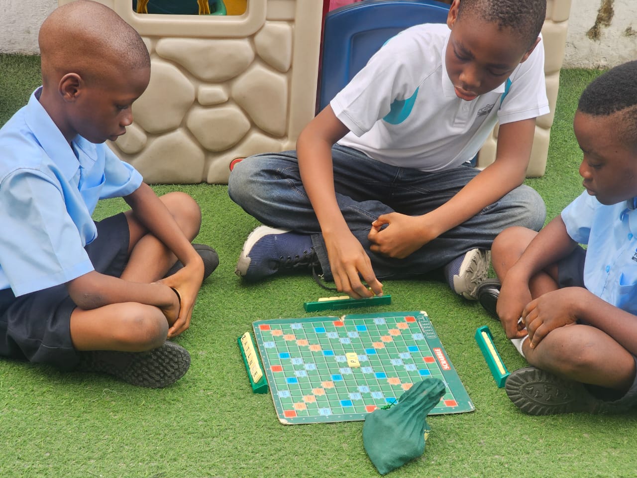 Children playing board games outdoor